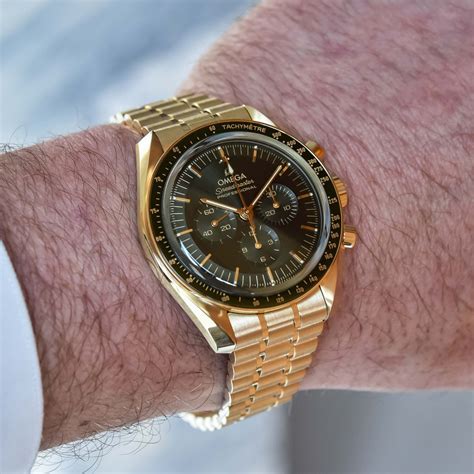 omega speedmaster yellow gold green dial|omega white speedmaster daniel craig.